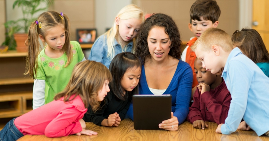 children looking at a tablet